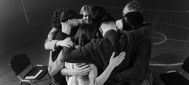 a group of people hugging 