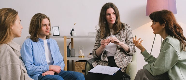 People talking during a session of a group therapy program in Virginia