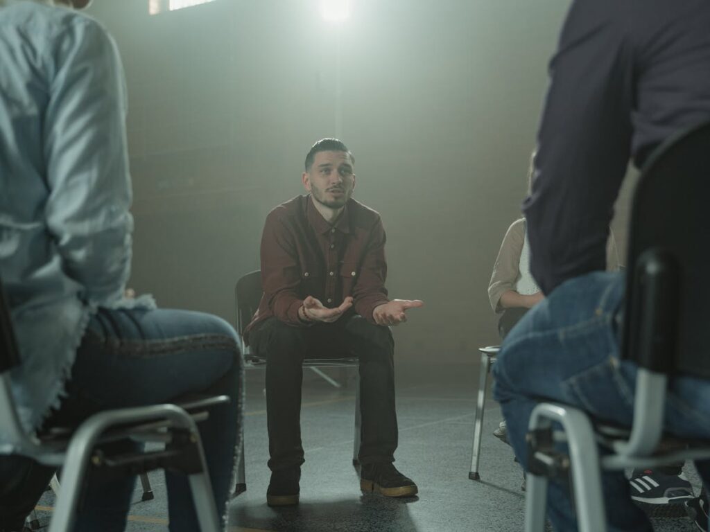 man sitting in therapy