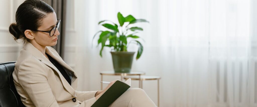 A therapist taking notes during a session at a rehab Norfolk VA center